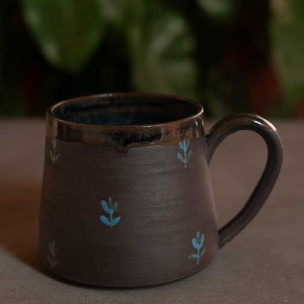 Black floral motif mug